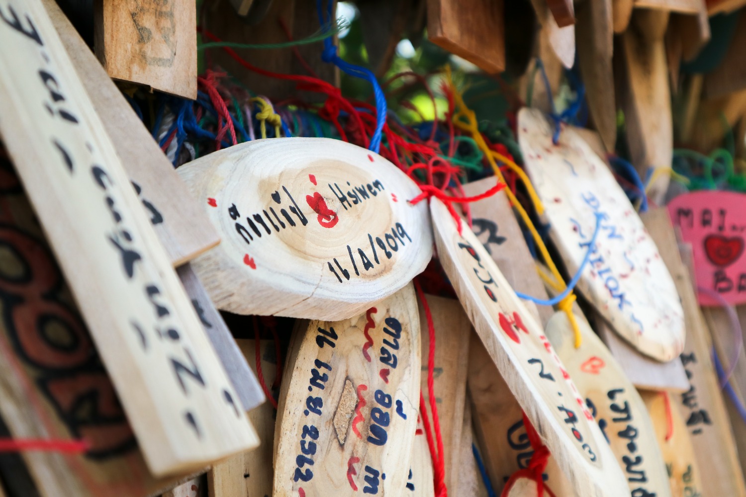 wooden-signs-hanging-make-wish-attractions-etong-village-thailand.jpg