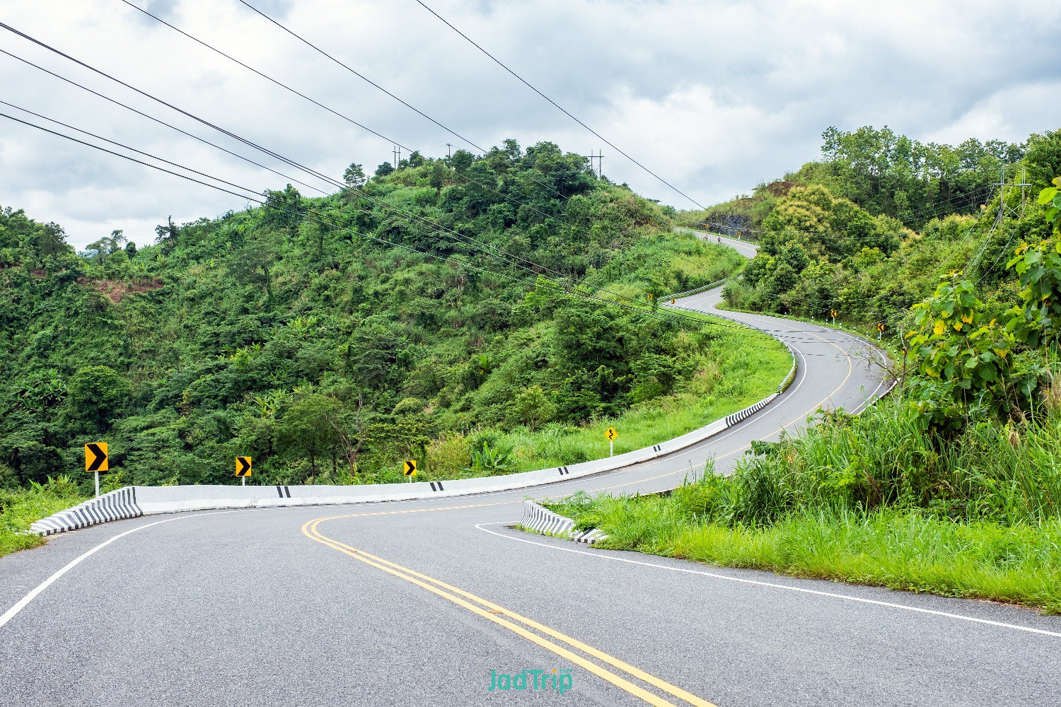 asphalt-road-curved-hill.jpg