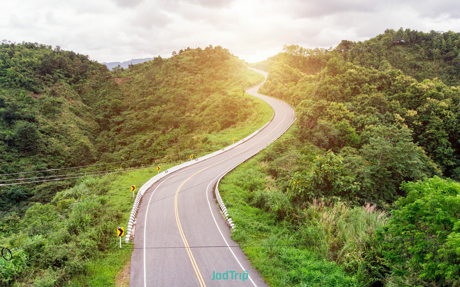 asphalt-curved-highway-mountain-background.jpg