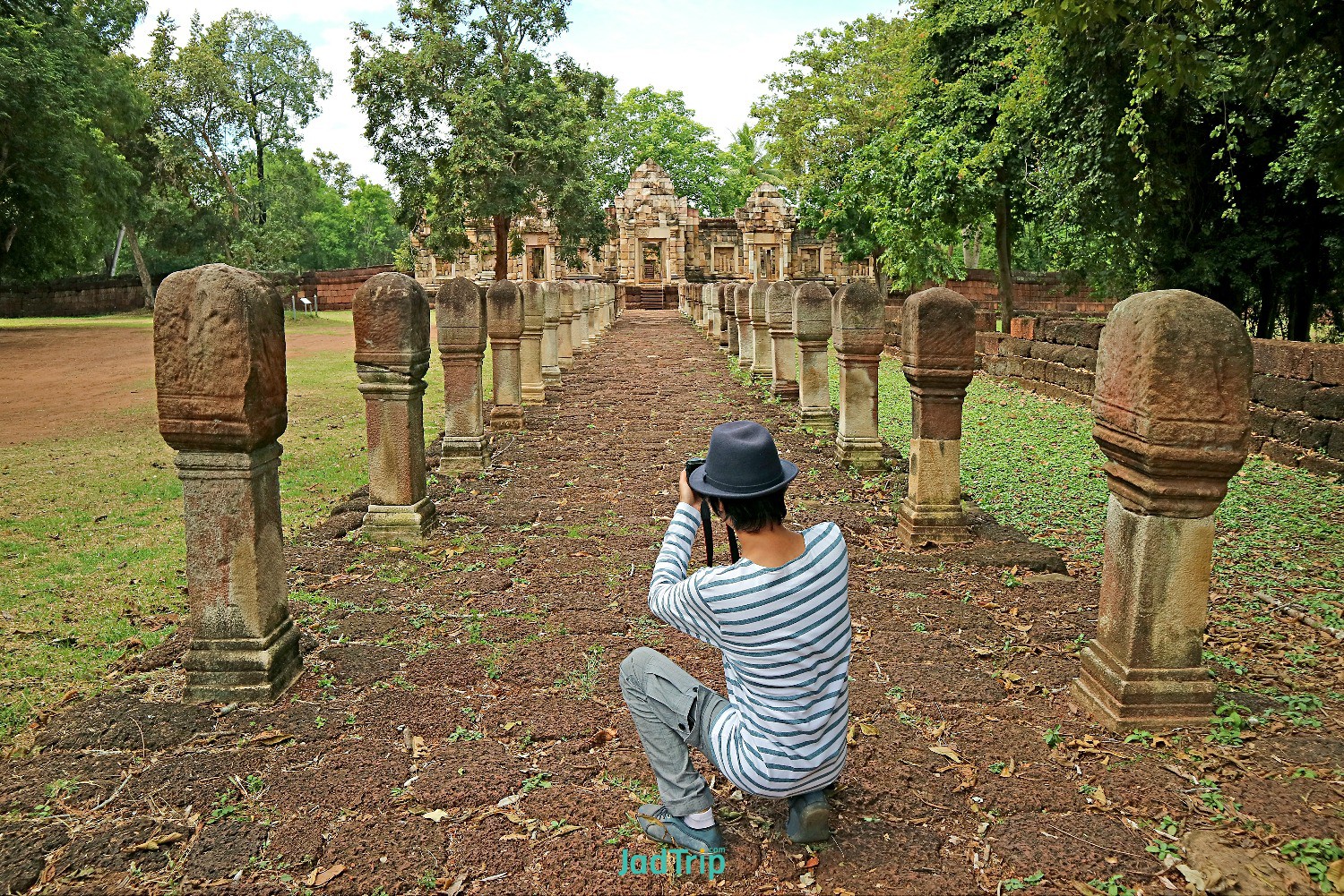 man-taking-photos-prasat-sdok-kok-thom-khmer-temple-sa-kaeo-province-thailand.jpg