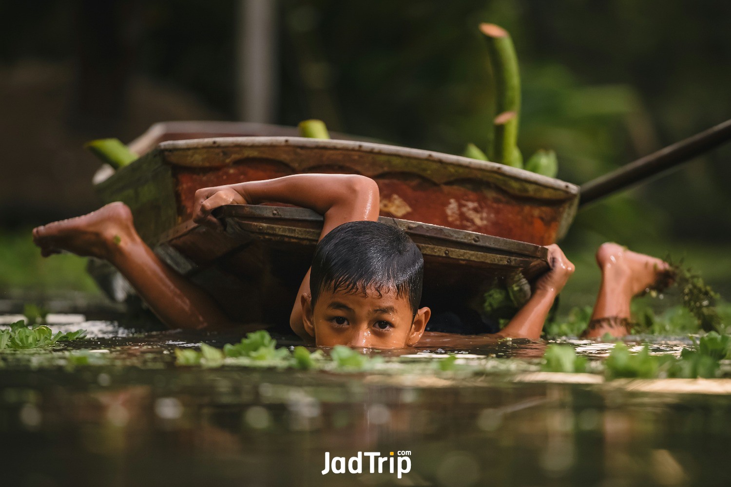 ratchaburi-thailand-april-9-2019-boy-swimming-cannal-near-damnoen-saduak-floatin.jpg