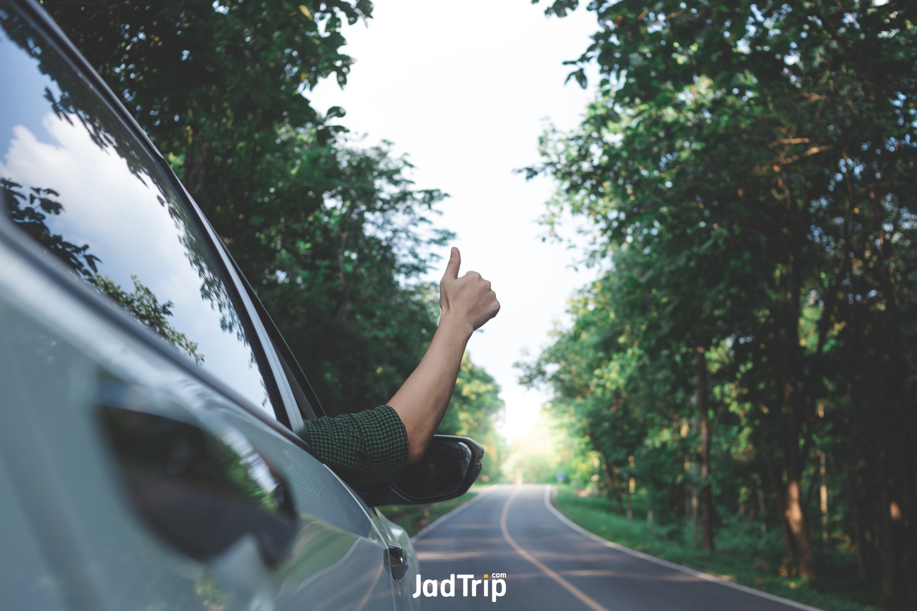 man-driver-feeling-wind-through-his-hands-while-driving-country-side_jadtrip.jpg