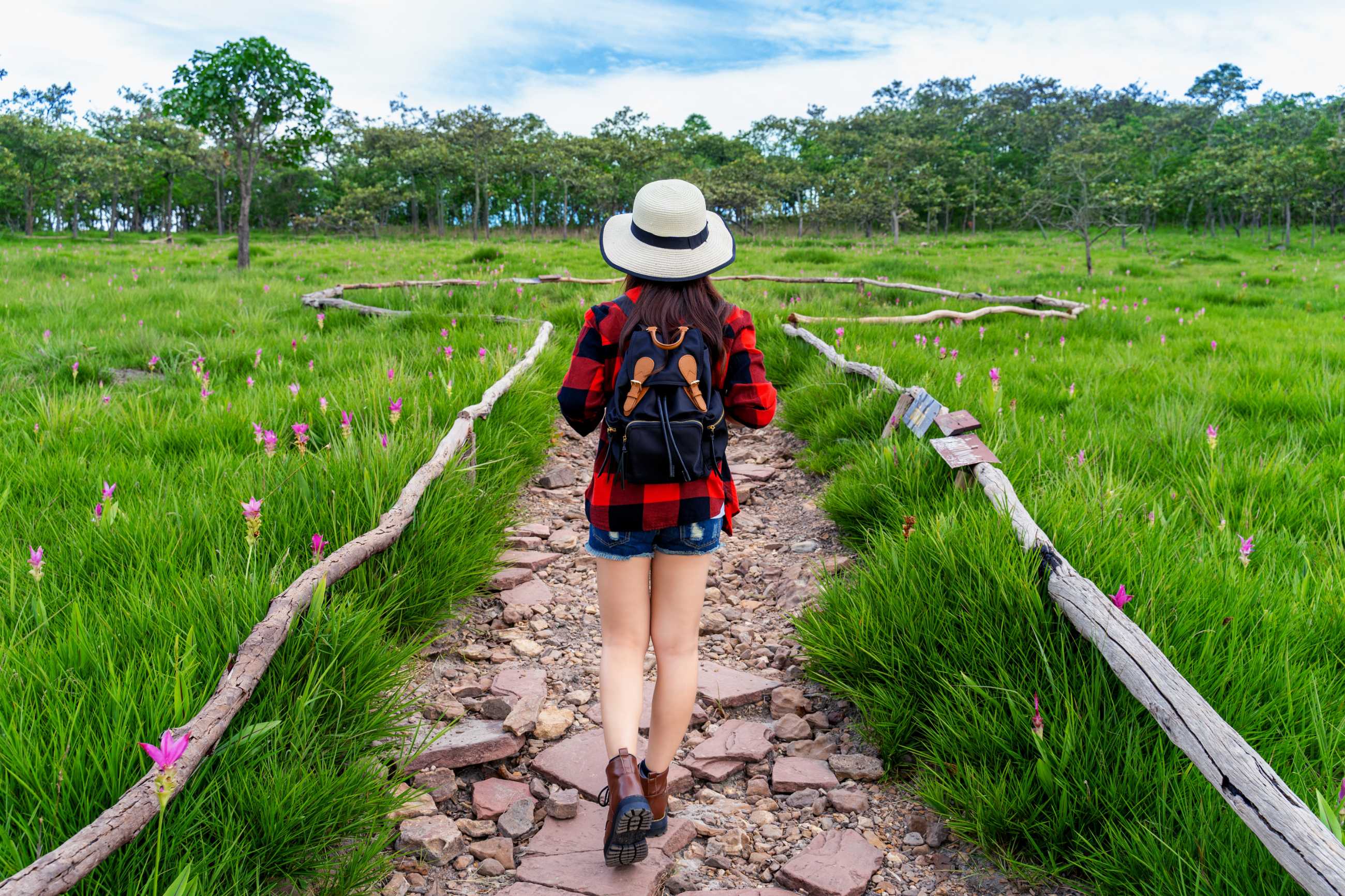 woman-traveler-with-backpack-walking-krachiew-flower-field-thailand-travel-conce.jpg